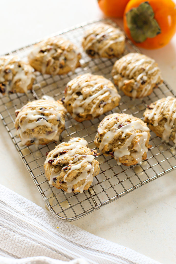 photo of persimmon cookies with orange glaze on a wire cooling rack