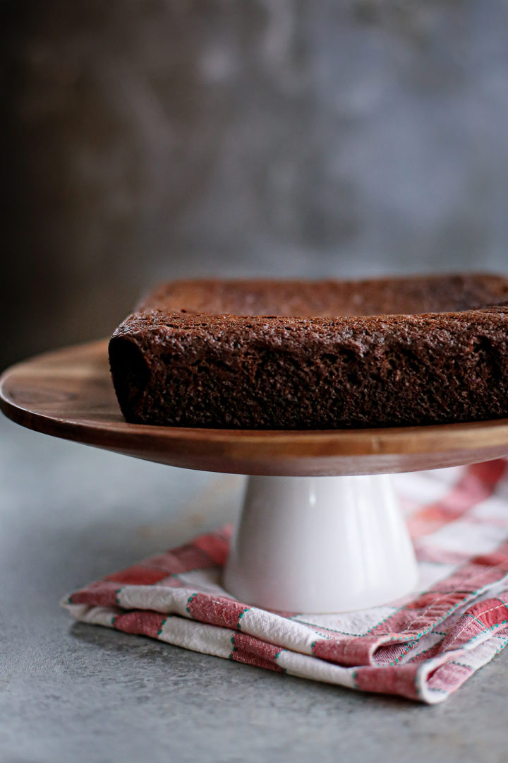 photo of a chocolate gingerbread cake on a cake steand