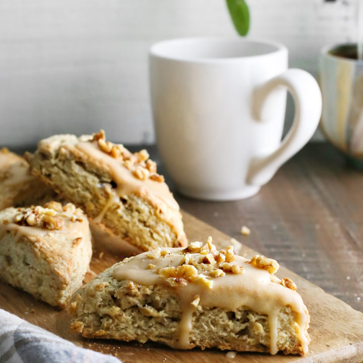 photo of maple scones on a cutting board next to a mug of coffee for brunch