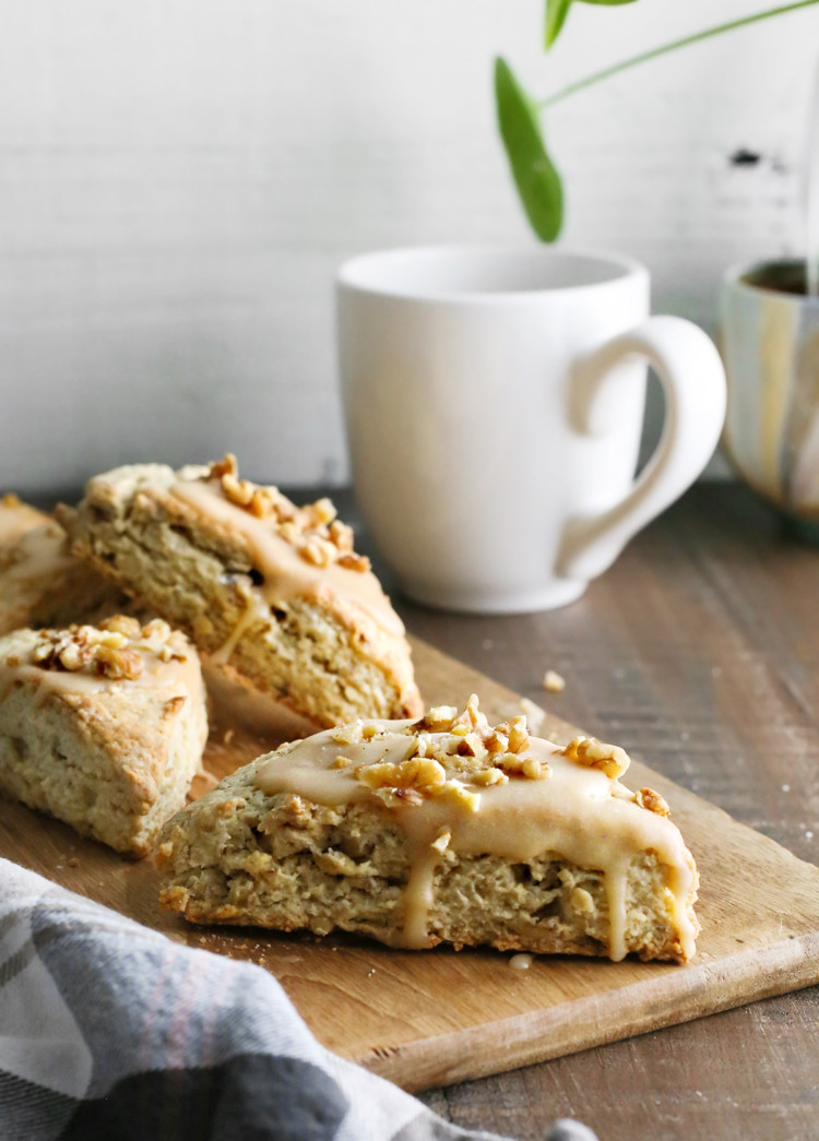 photo of maple scones on a cutting board next to a mug of coffee for brunch