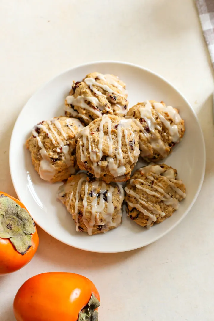 photo of orange glazed persimmon cookies on a white plate