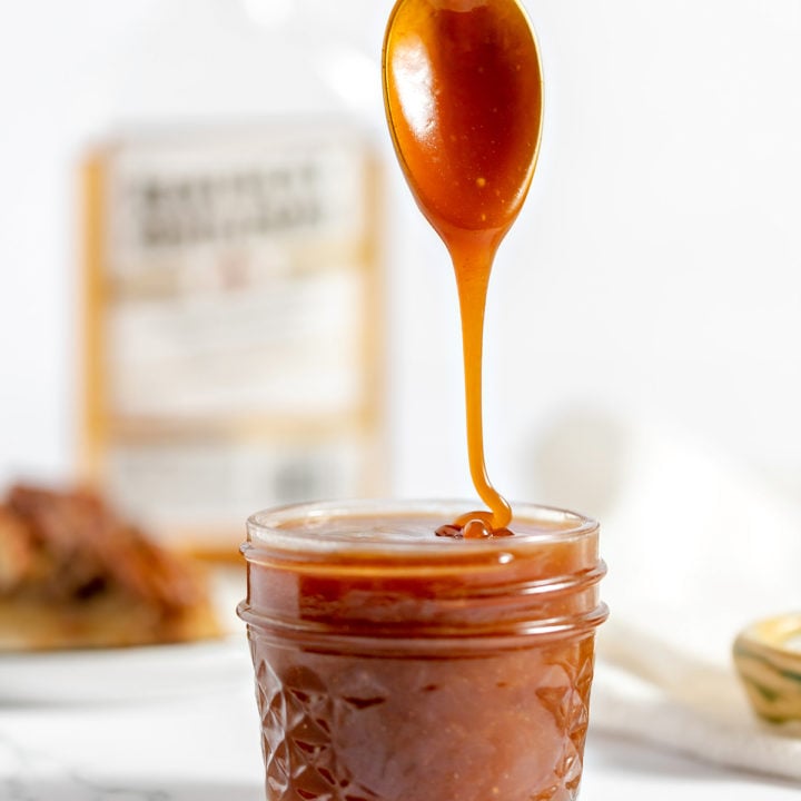 photo of rum caramel sauce drizzling off a spoon