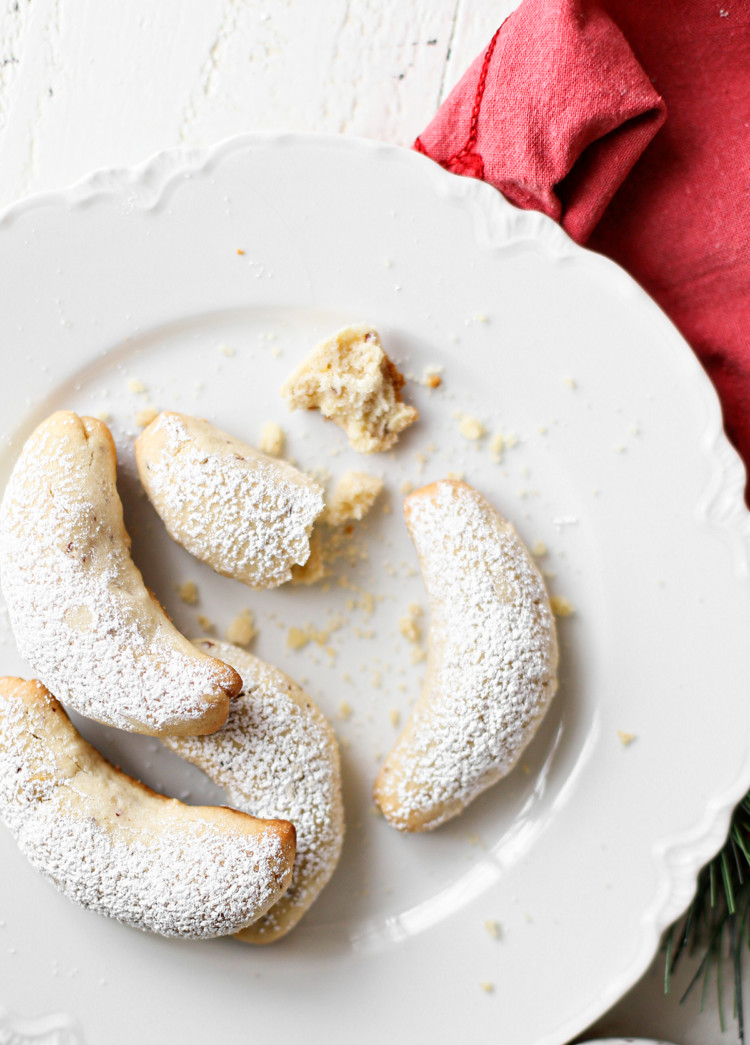 photo of almond crescent cookies on a white plate