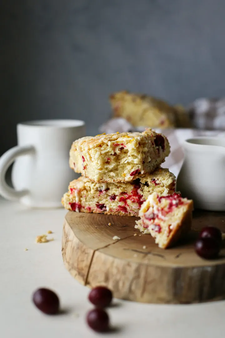 photo the best of cranberry orange scones with a mug of coffee