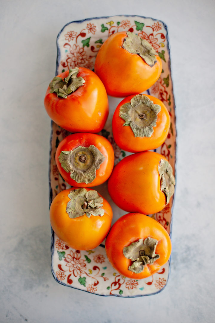 photo of hachiya persimmons in a bowl on a counter to use in a persimmon cookie recipe
