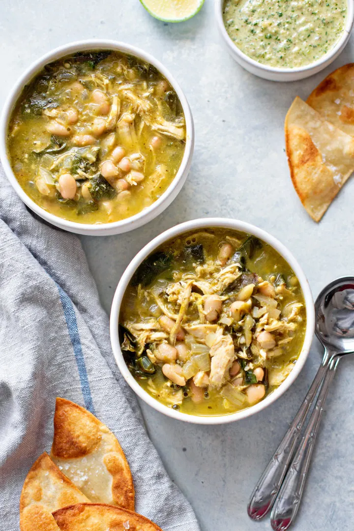 photo of a table set with bowls of this chicken chili verde recipe