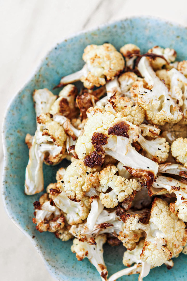 close up overhead shot of a plate of oven roasted cauliflower