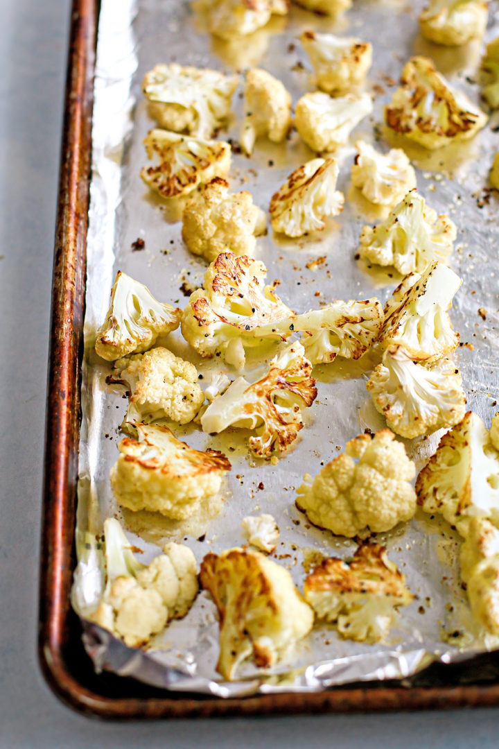 Photo of roasted cauliflower on a baking sheet after cooking