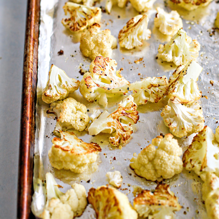 photo of roasted cauliflower on a baking sheet