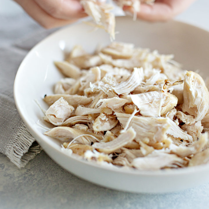 photo of woman making shredded chicken