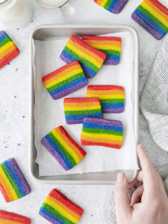 photo of a baking sheet with rainbow sugar cookies on it (a rainbow cookie recipe for st patricks day)