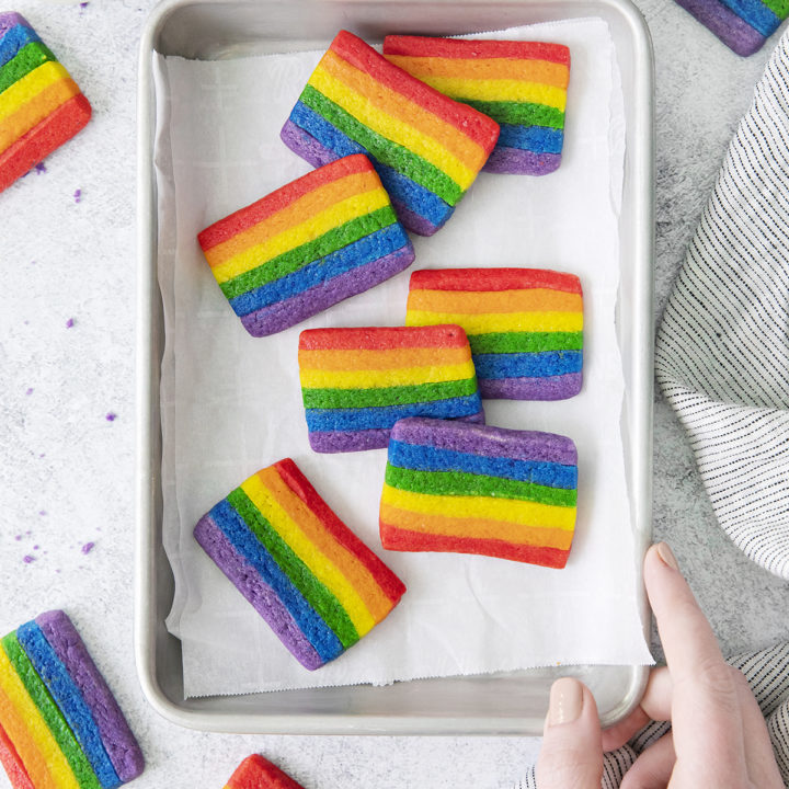 photo of a baking sheet with rainbow sugar cookies on it (a rainbow cookie recipe for st patricks day)