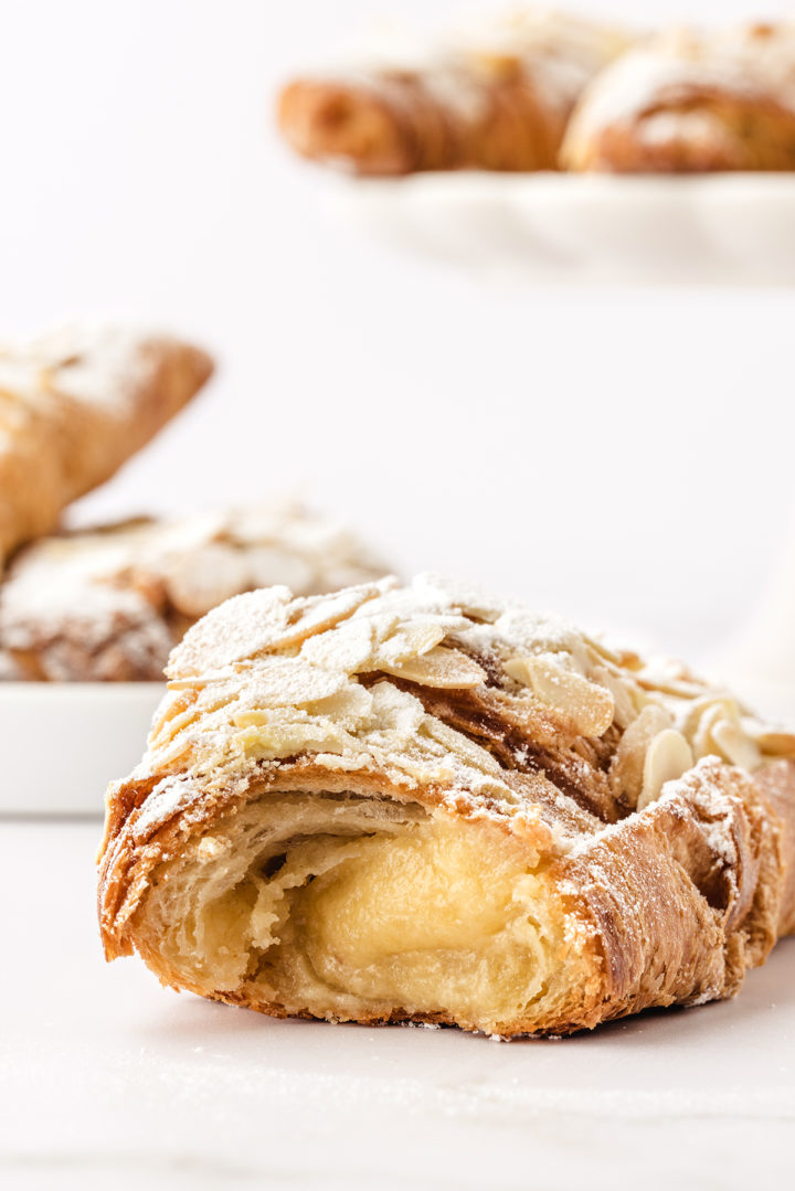 close up photo of an almond croissant with almond filling