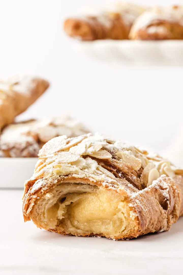 close up photo of an almond croissant with almond filling