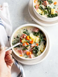 photo of ham soup in a bowl with a spoon