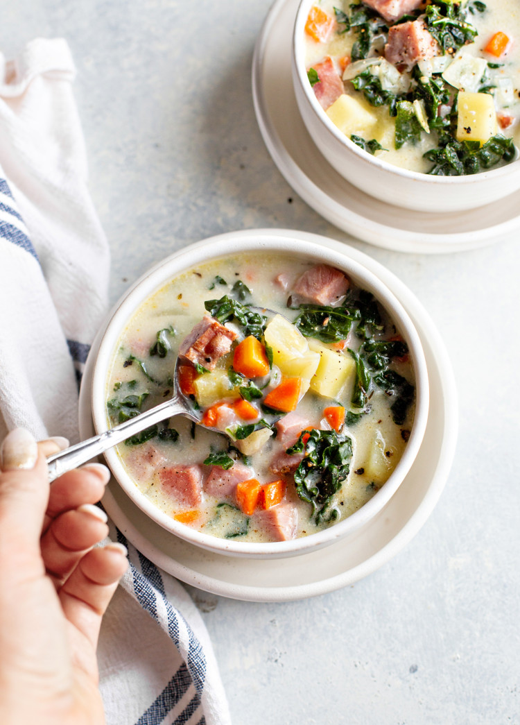 photo of ham soup in a bowl with a spoon