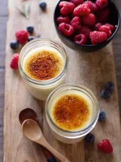 photo of 2 jars of sous vide creme brulee with fresh berries