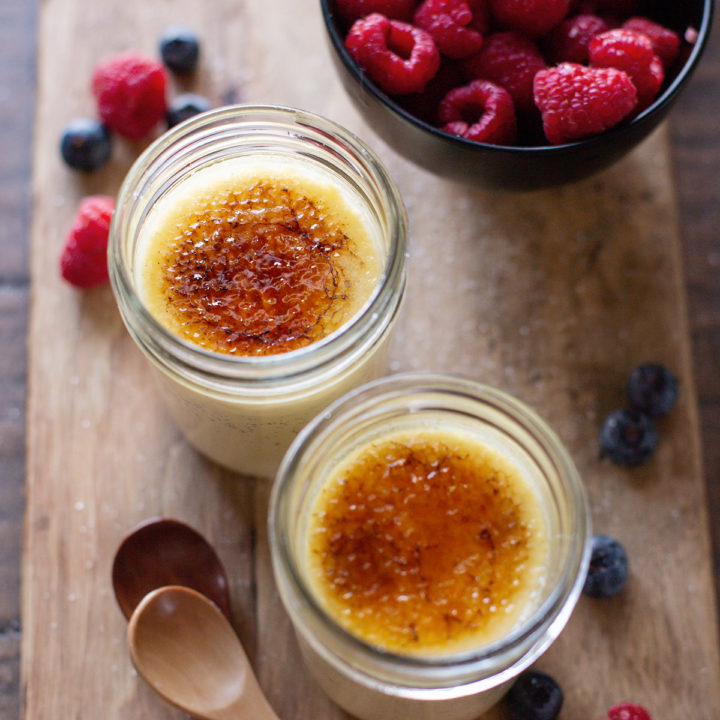 photo of 2 jars of sous vide creme brulee with fresh berries