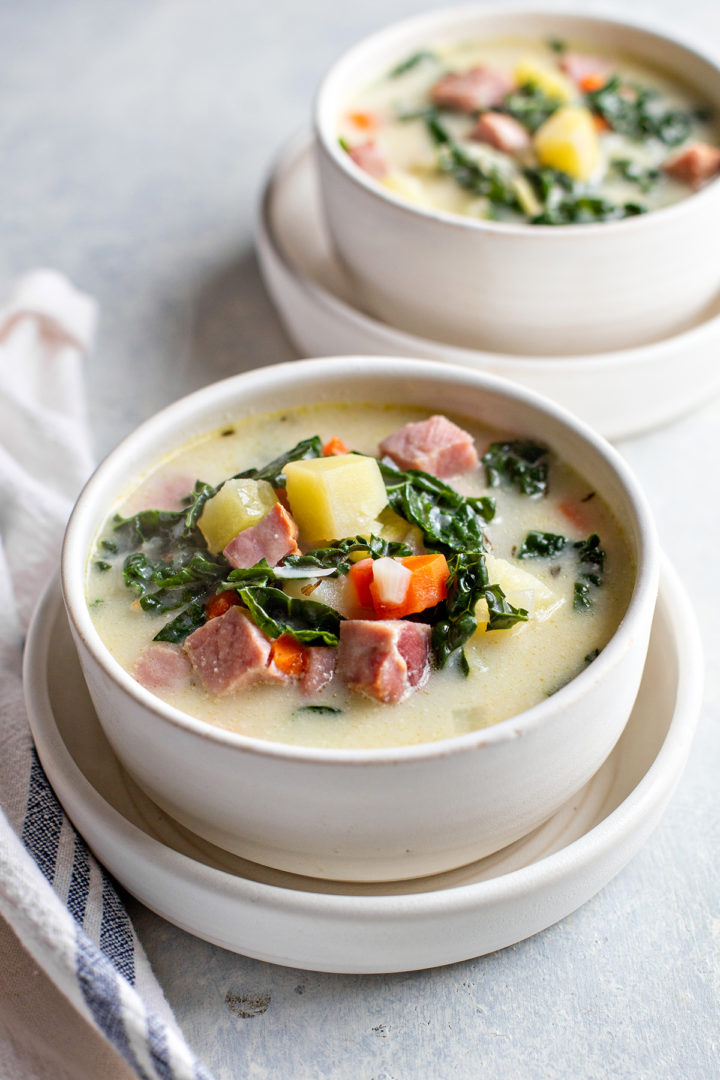 photo showing this ham soup recipe completed - two bowls of creamy ham and potato soup