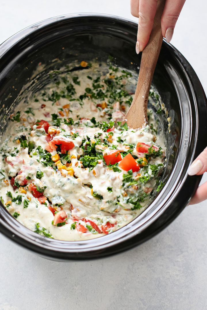 photo of woman making crock pot white queso dip recipe