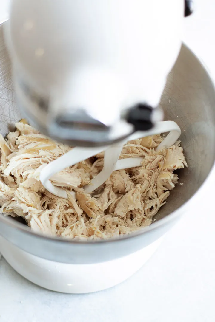 photo showing how to make shredded chicken using a stand mixer