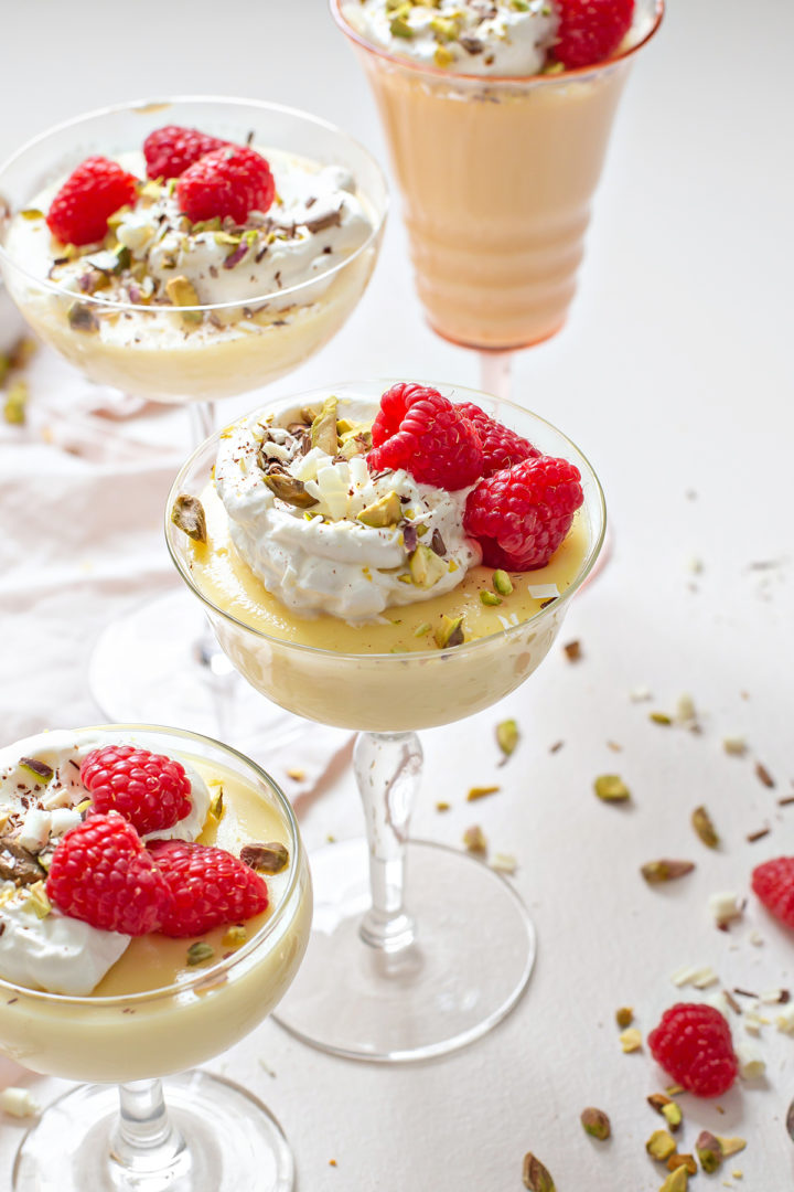 close up photo of dessert glasses with this white chocolate pudding recipe in it