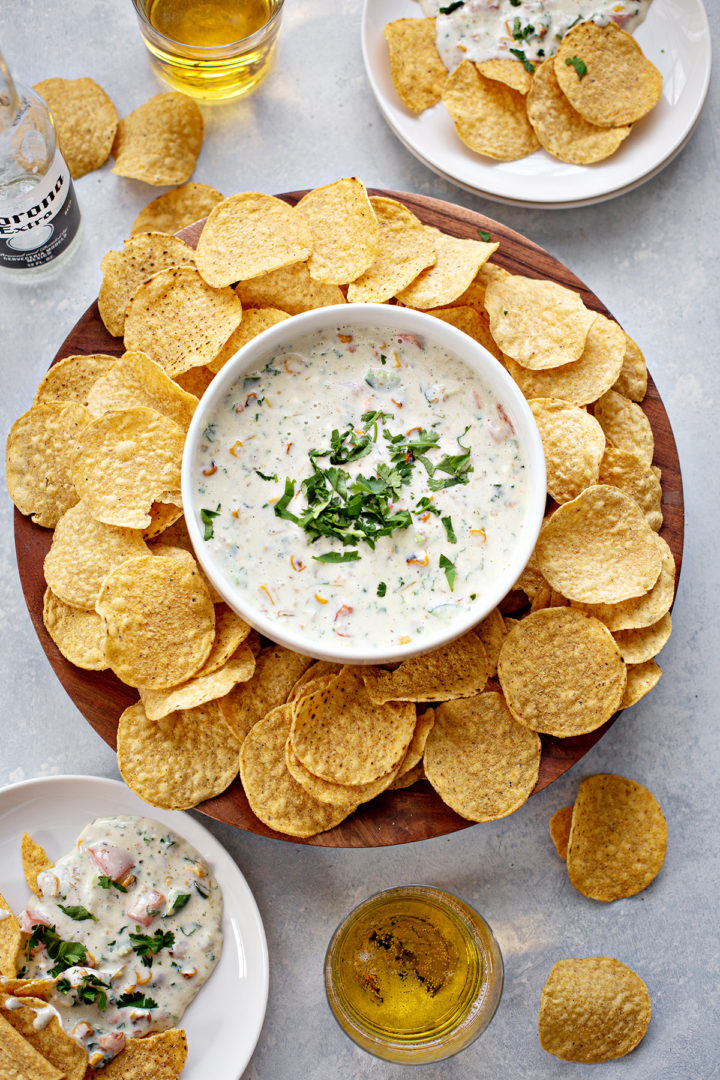 overhead photo of a plate of chips with white queso recipe