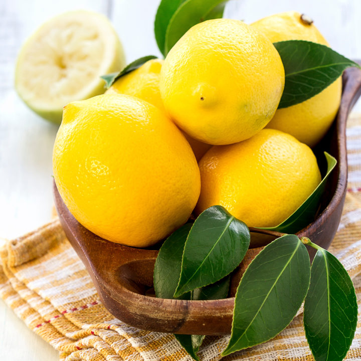 lemons in a wooden bowl for making lemon twists