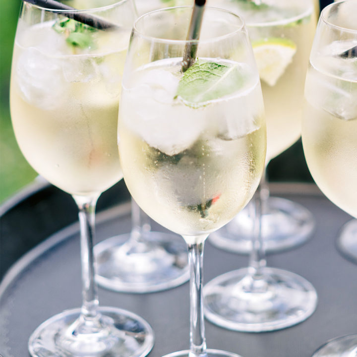 glasses of limoncello sprits on a serving tray