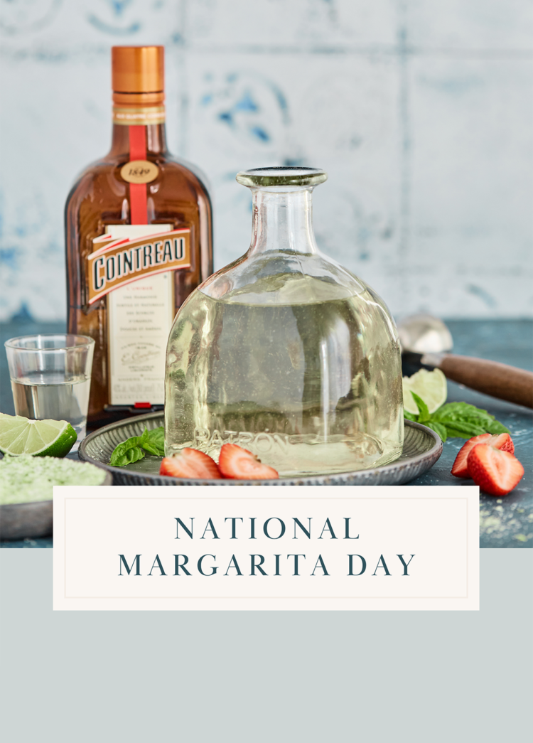 Ingredients for making a margarita recipe, including lime, tequila, and salt, arranged on a table in celebration of National Margarita Day.