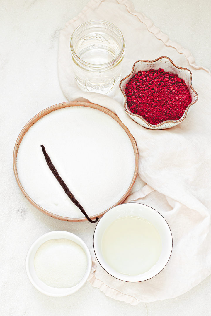 ingredients needed to make this raspberry marshmallow recipe arranged on a white marble background