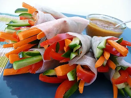 photo of fresh spring rolls on a blue serving plate
