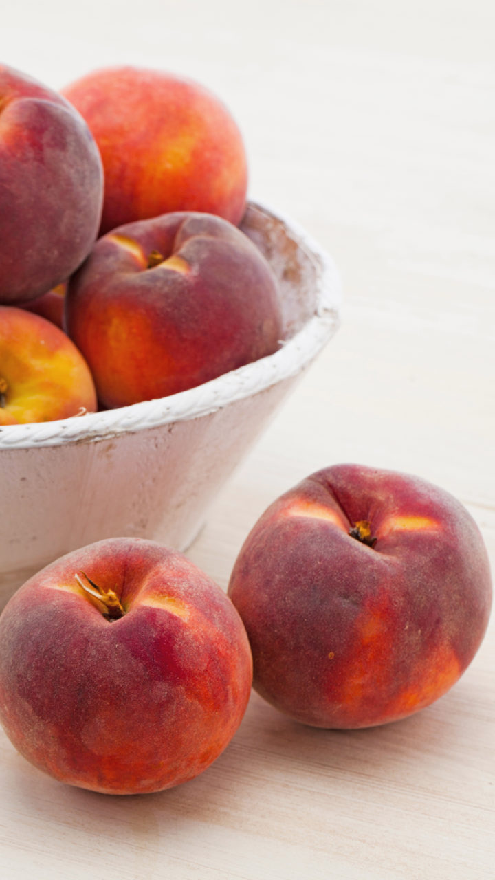 A bowl of peaches getting ready to use in this how to freeze peaches tutorial