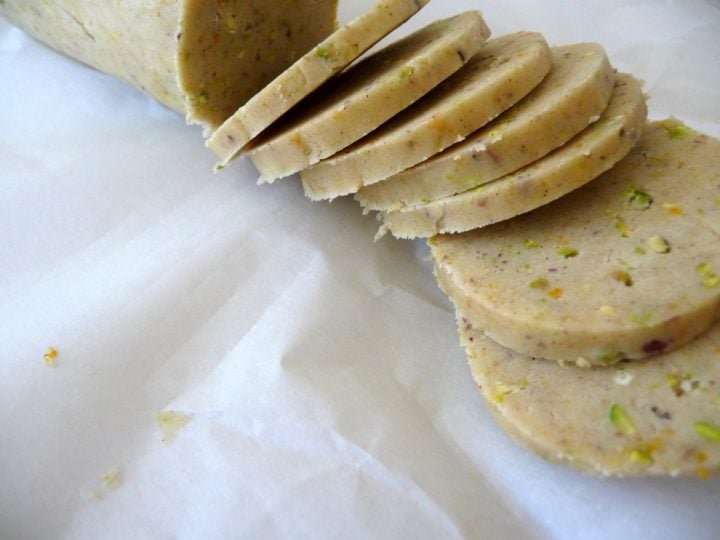 a roll of cannoli cookie dough being sliced