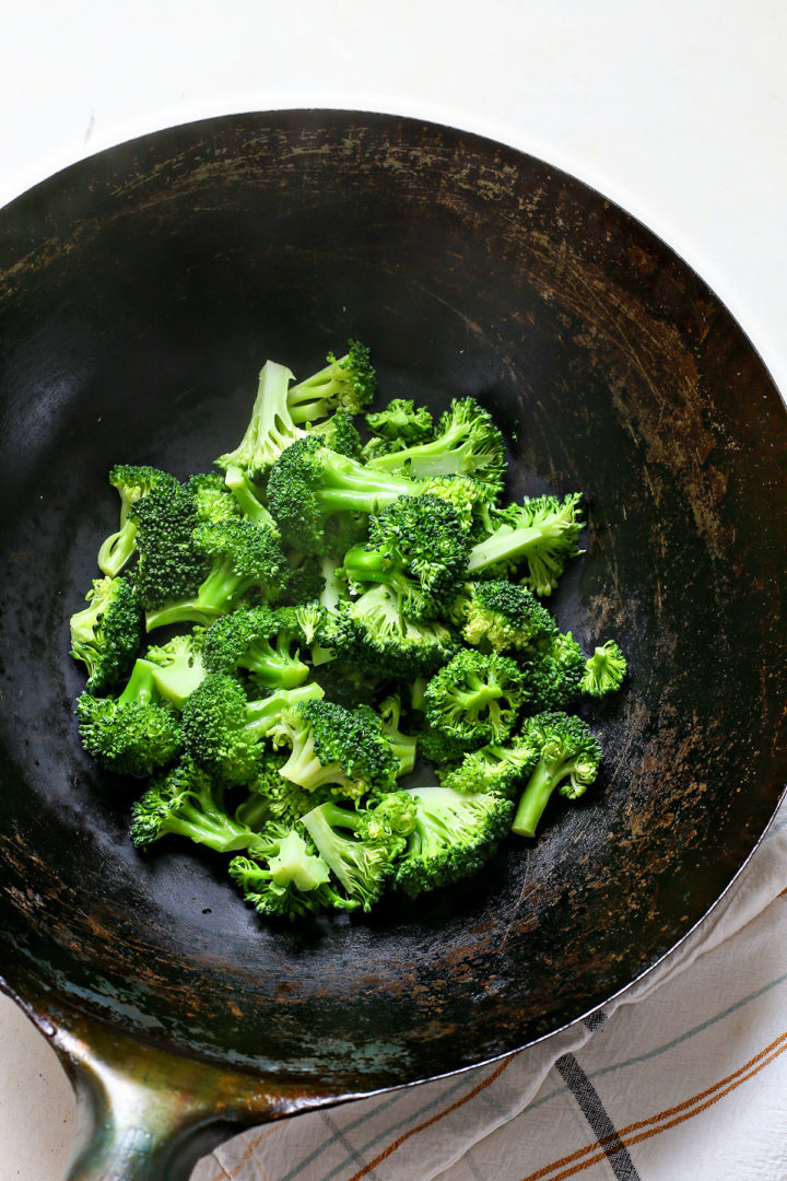broccoli cooking in a wok for a chinese beef and broccoli stir fry recipe