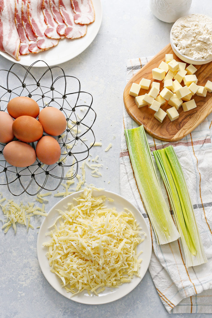 overhead photo quiche lorraine ingredients for this easy bacon and leek quiche