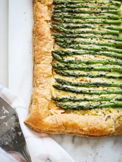 an asparagus tart on a marble board