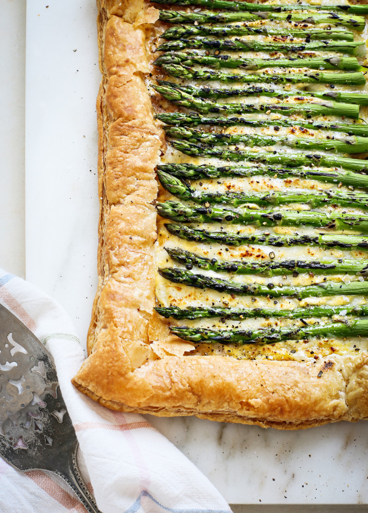 an asparagus tart on a marble board