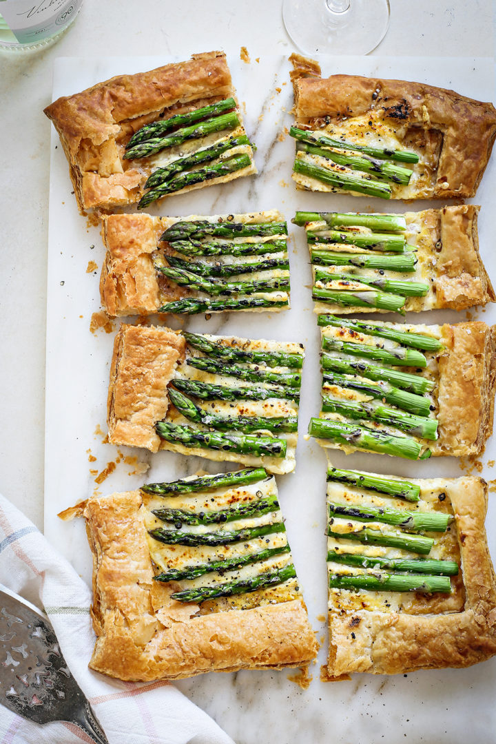 cut pieces of an asparagus tart for serving