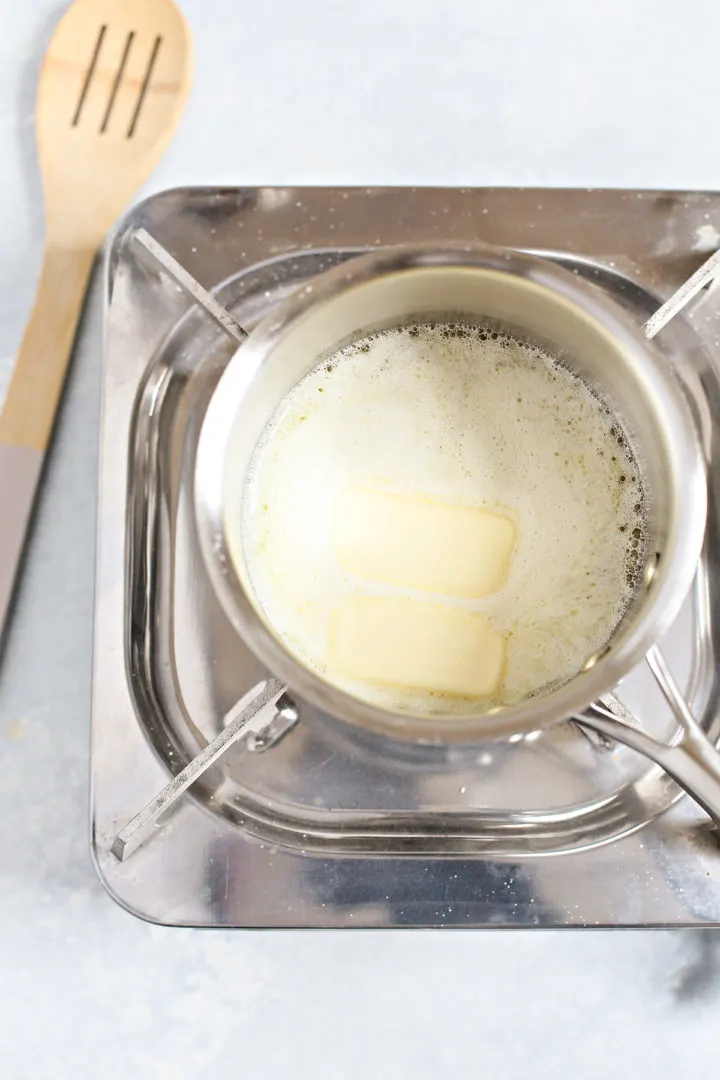 step 2 showing how to make brown butter - butter melting in a saucepan