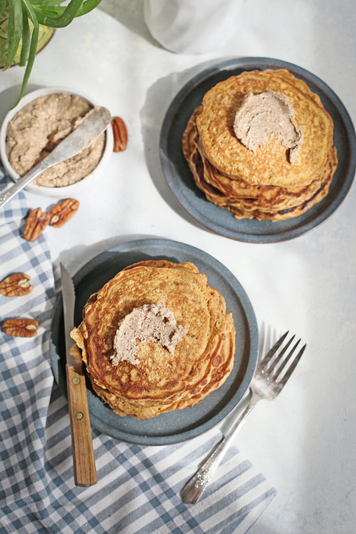 photo of a table set with two plates of carrot pancakes