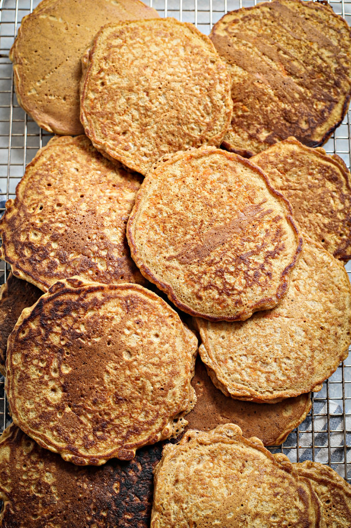 cooked pancakes with carrots on a wire rack