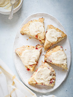 strawberry scones with lemon glaze on a white platter