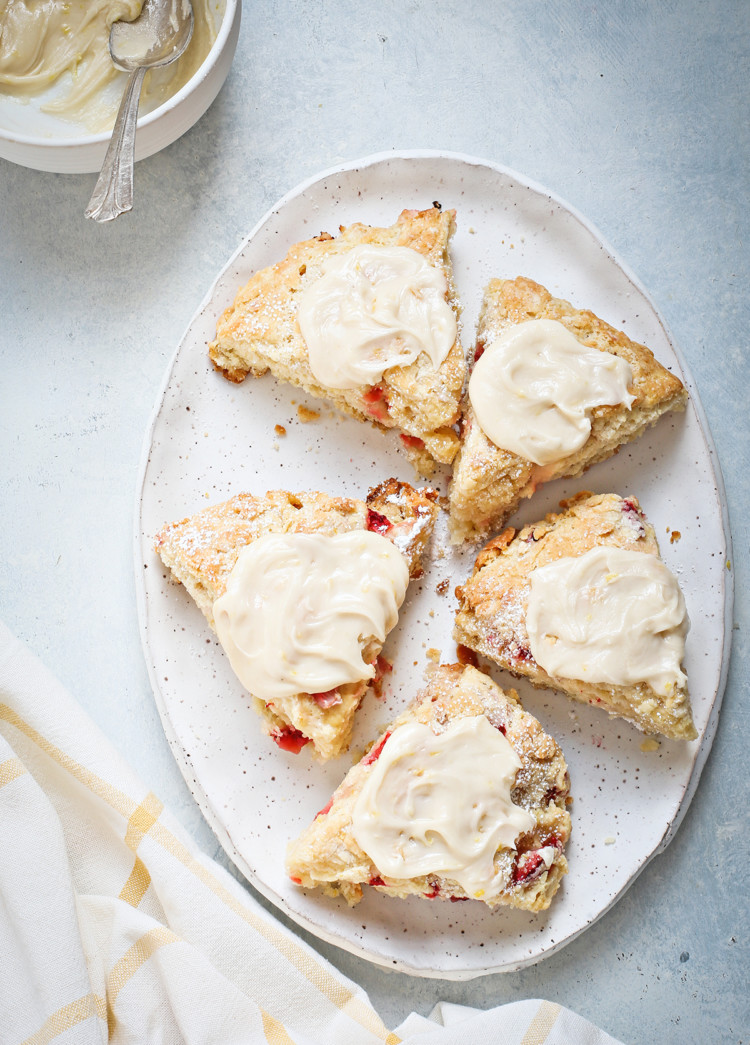 strawberry scones with lemon glaze on a white platter