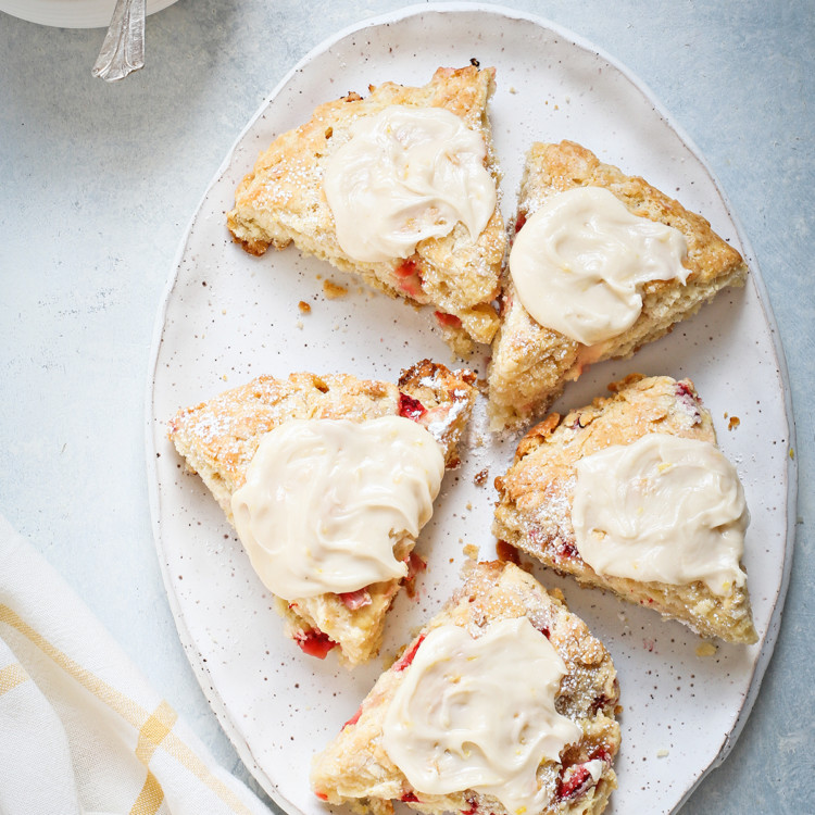 strawberry scones with lemon glaze on a white platter
