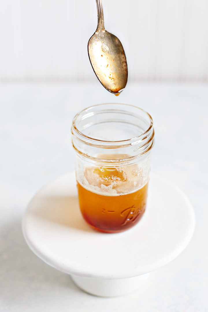 photo of brown butter in a jar with a spoon