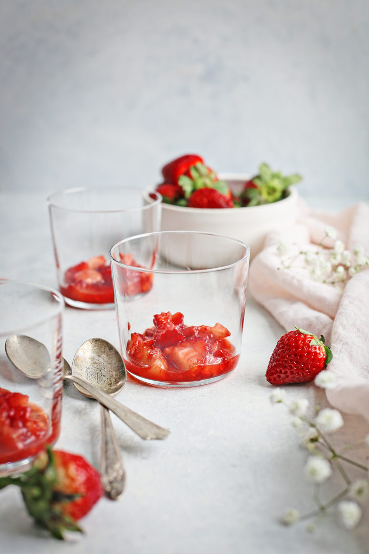 clear dessert jar with a layer of strawberries to make this recipe for strawberry cream 