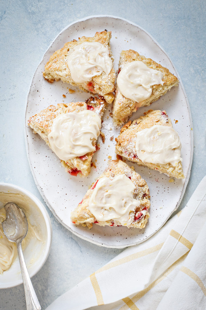 lemon glazed strawberry scones on a serving platter