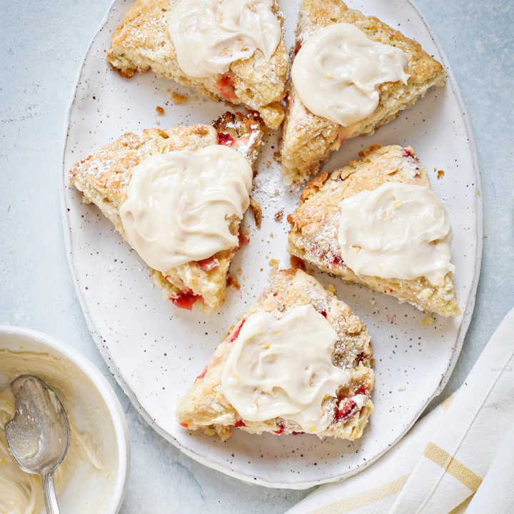 strawberry scones with lemon glaze on a white platter