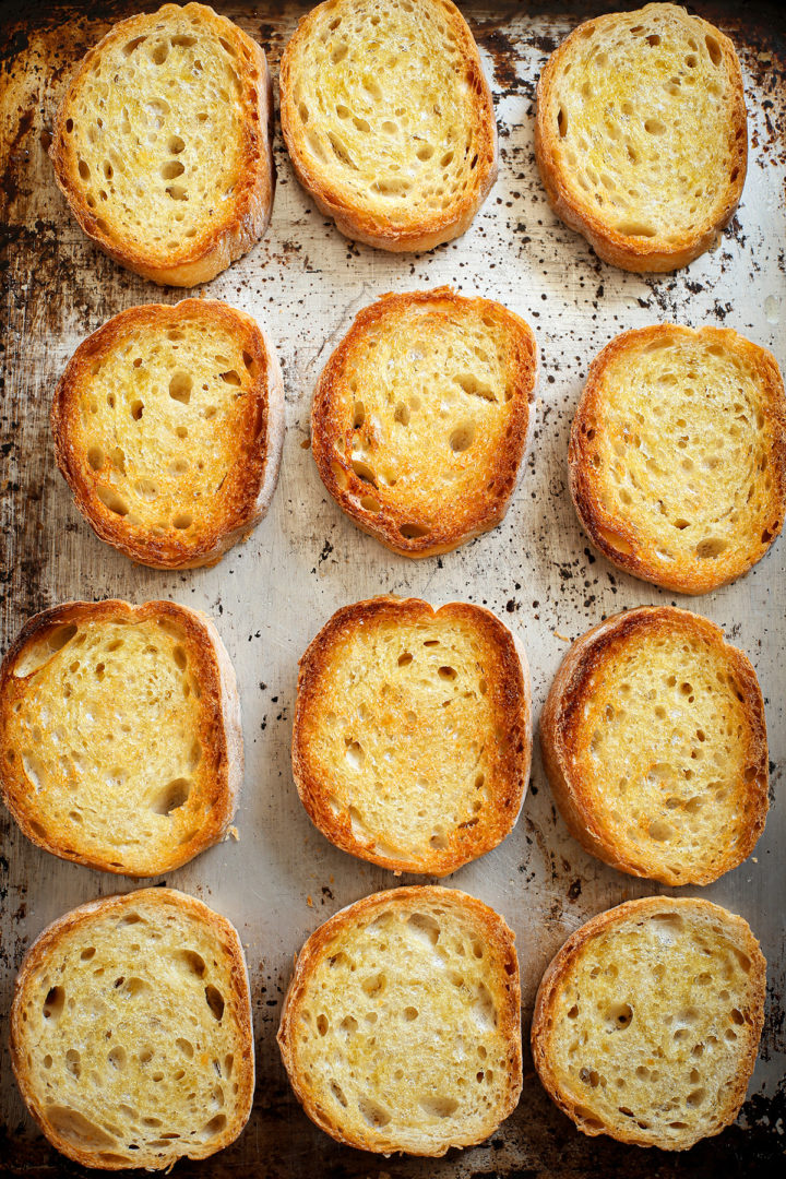 toasted ciabatta bread slices for making a recipe for strawberry bruschetta